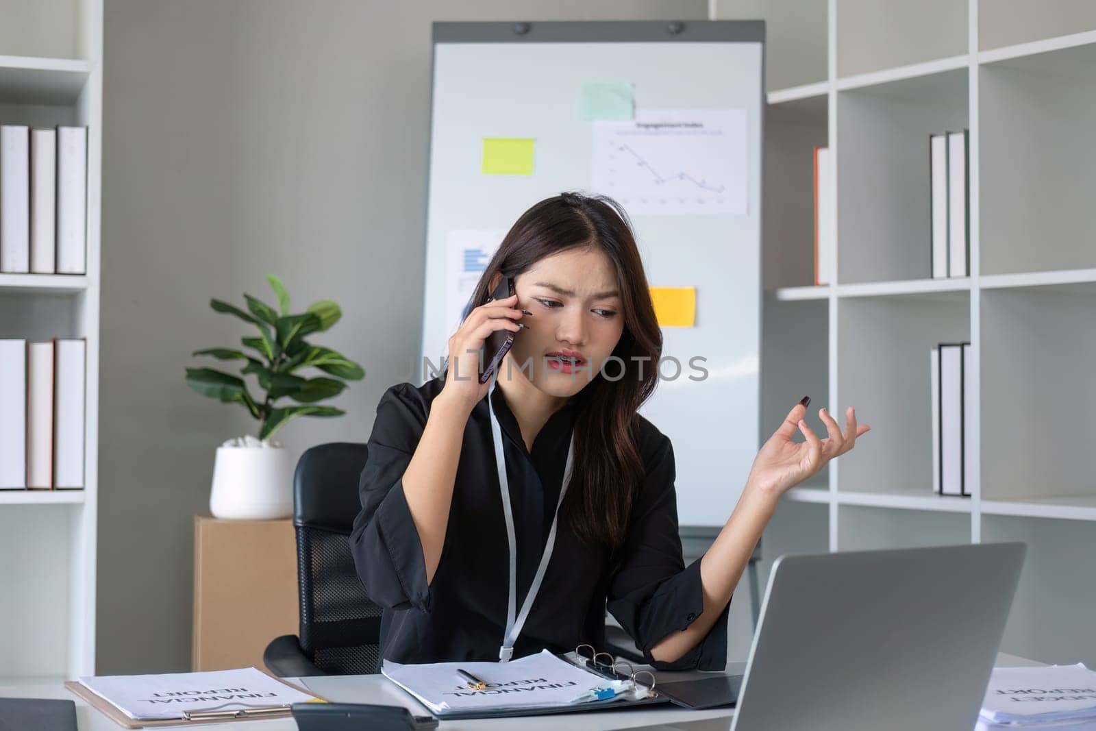 Happy asian business woman have the joy of talking on the smartphone, tablet and laptop on the modern office.