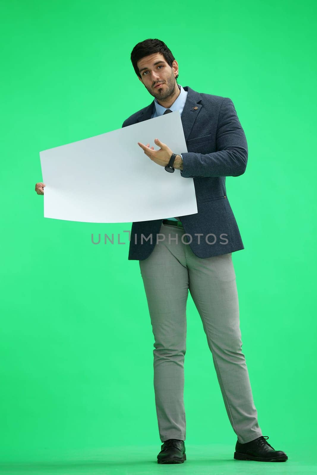 A man in an office suit holds a white sheet in front of him by Prosto