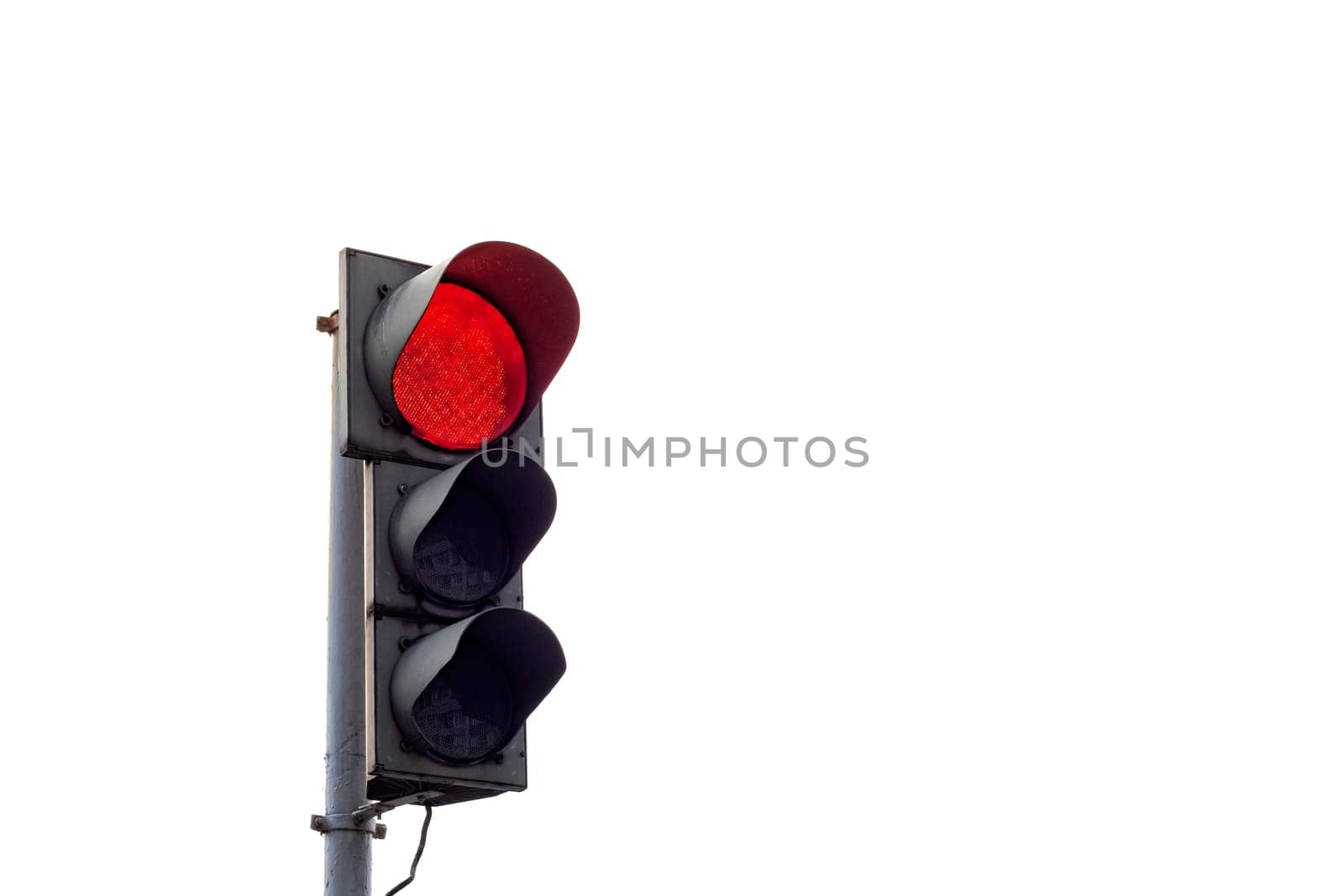 Red traffic light close up, isolated on white background