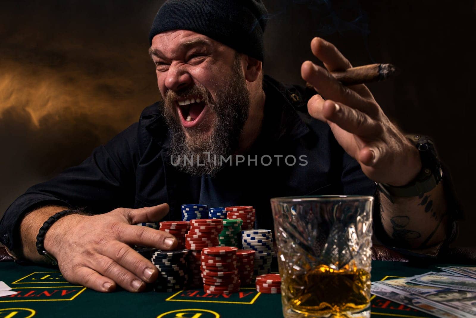 Man is playing poker. Emotional fail in game, game over for card player, man very angry with foolish choices, losing all the chips on bank. by nazarovsergey