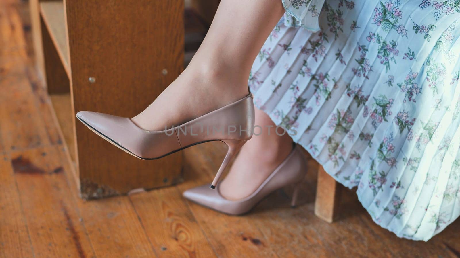 Young girl's legs with heeled shoes. by DovidPro