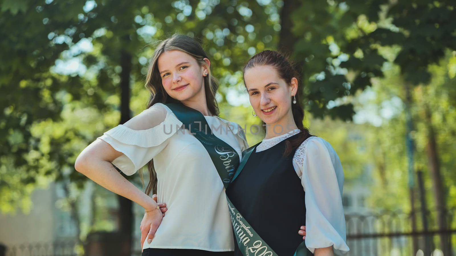 Portrait of two Russian schoolgirls graduating from high school. by DovidPro