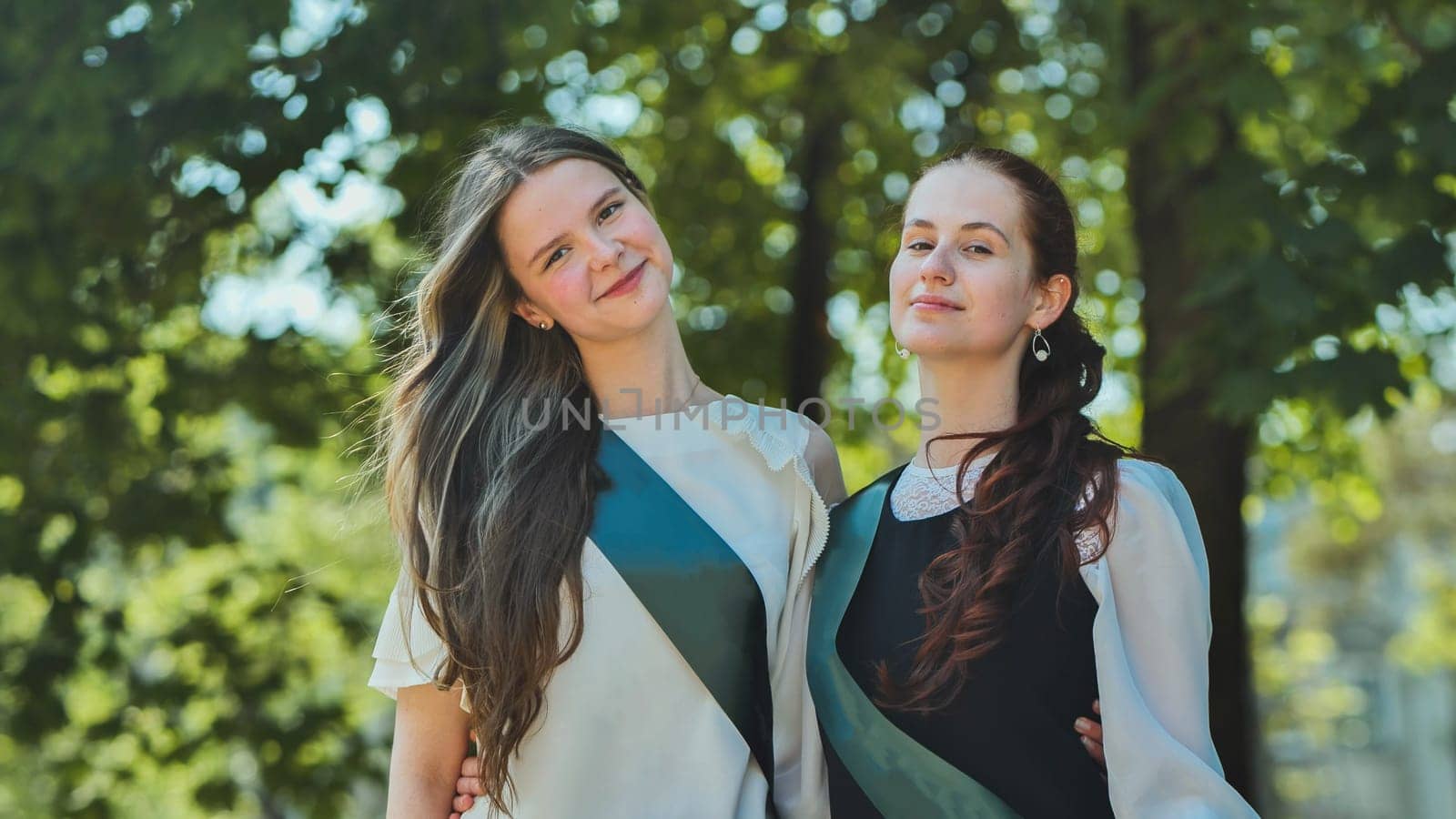 Portrait of two Russian schoolgirls graduating from high school