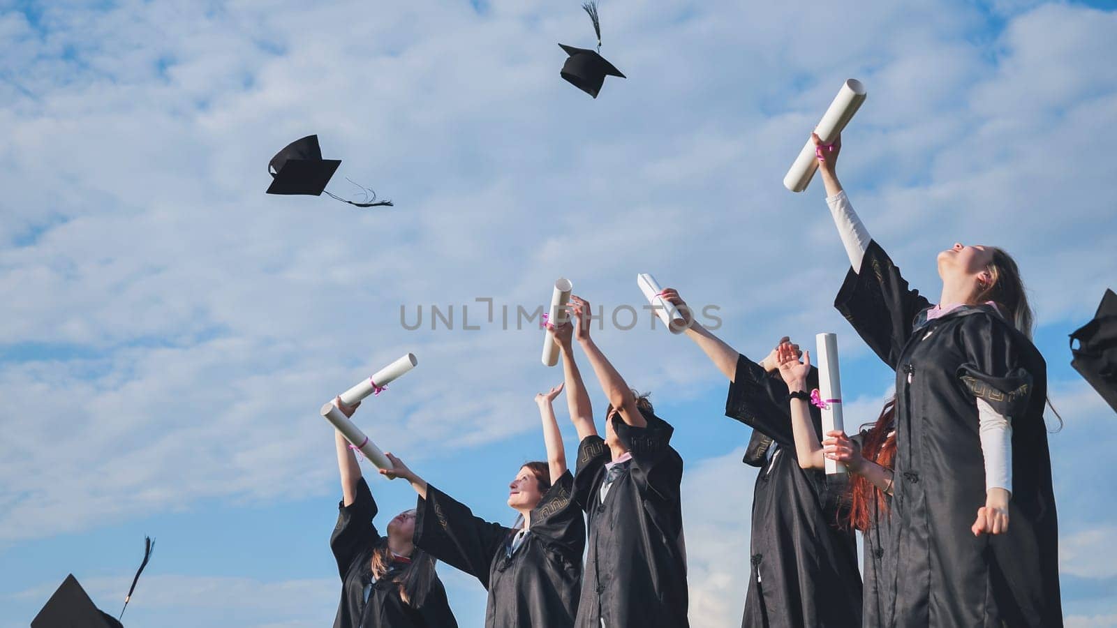 Graduation Caps Thrown in the Air. by DovidPro