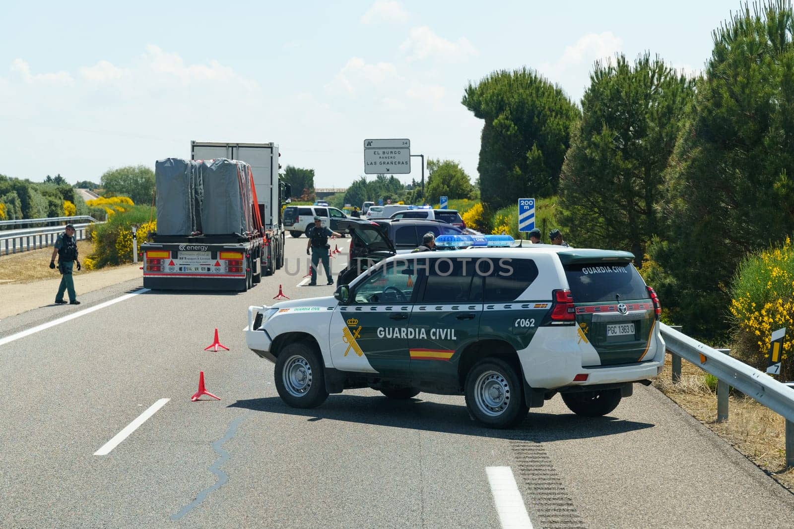 Sahagun, Spain - June 5, 2023: Civilian police are restricting traffic and blocking traffic with police vehicles.