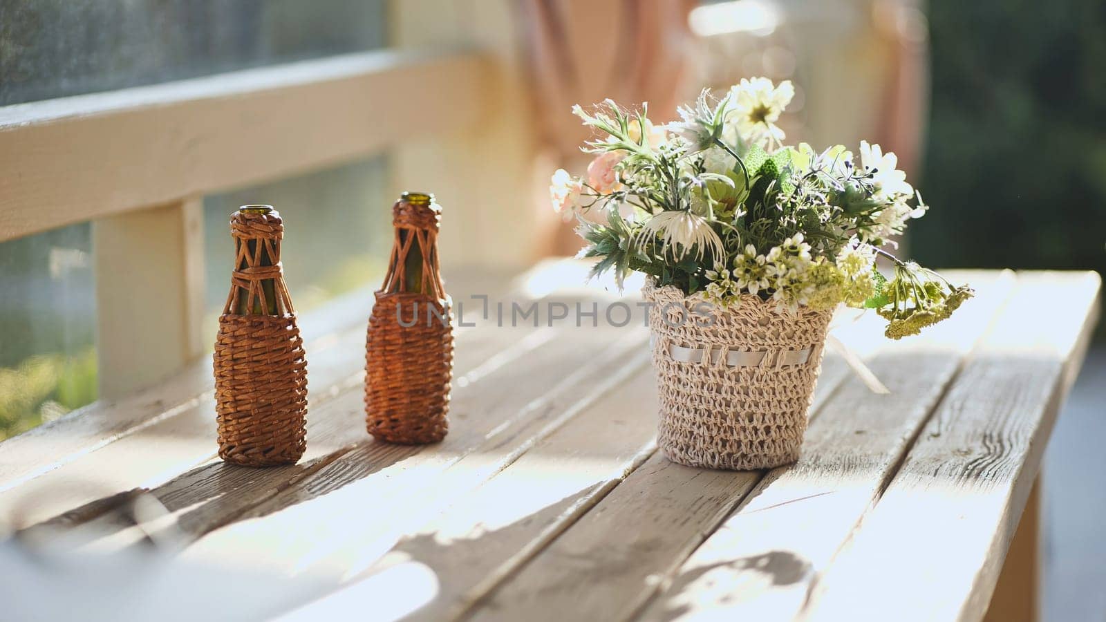 A vase of flowers on a table outside