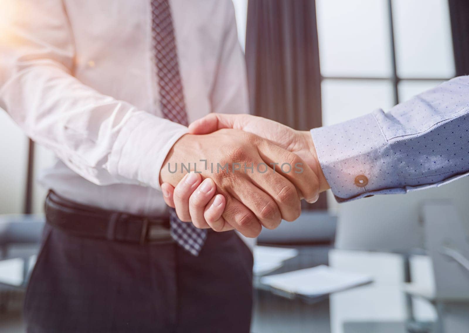 Good deal. Close-up of two business people shaking hands