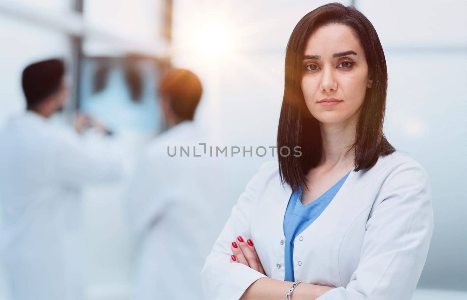 Portrait of a pensive woman doctor in a hospital corridor