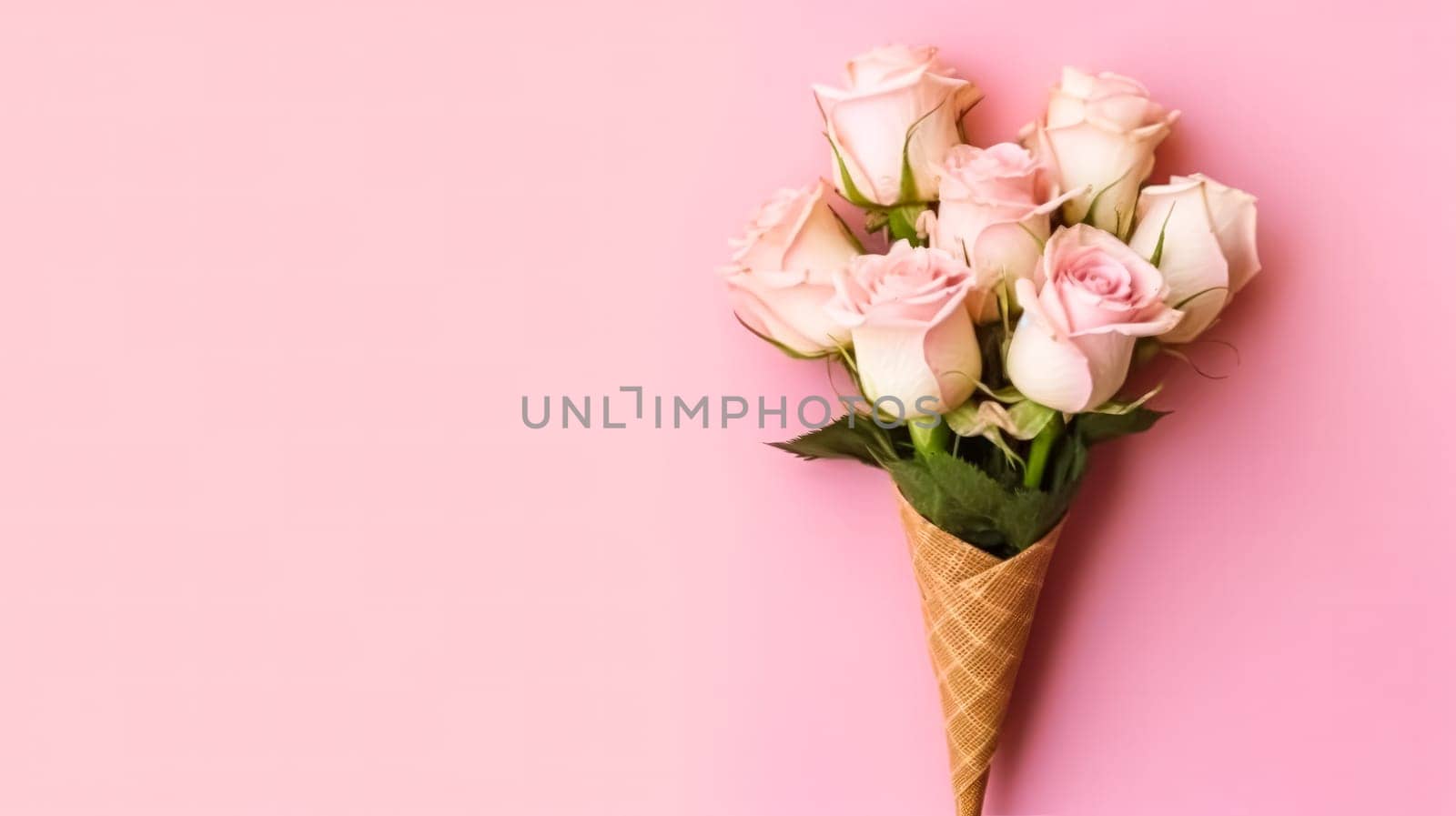 Delicious roses ice cream in a charming waffle cup, presented with minimalistic flair on a delightful pink background. A sweet treat for visual projects.