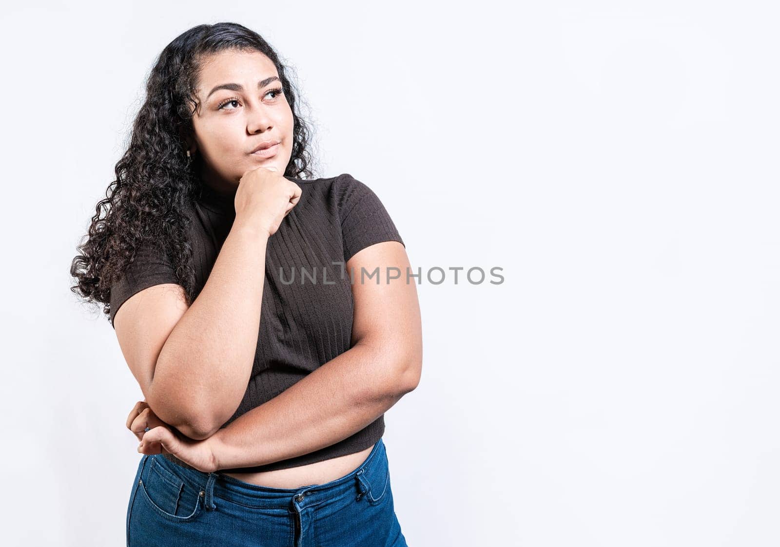 Girl wondering with hand on chin isolated. Thoughtful people with hand on chin