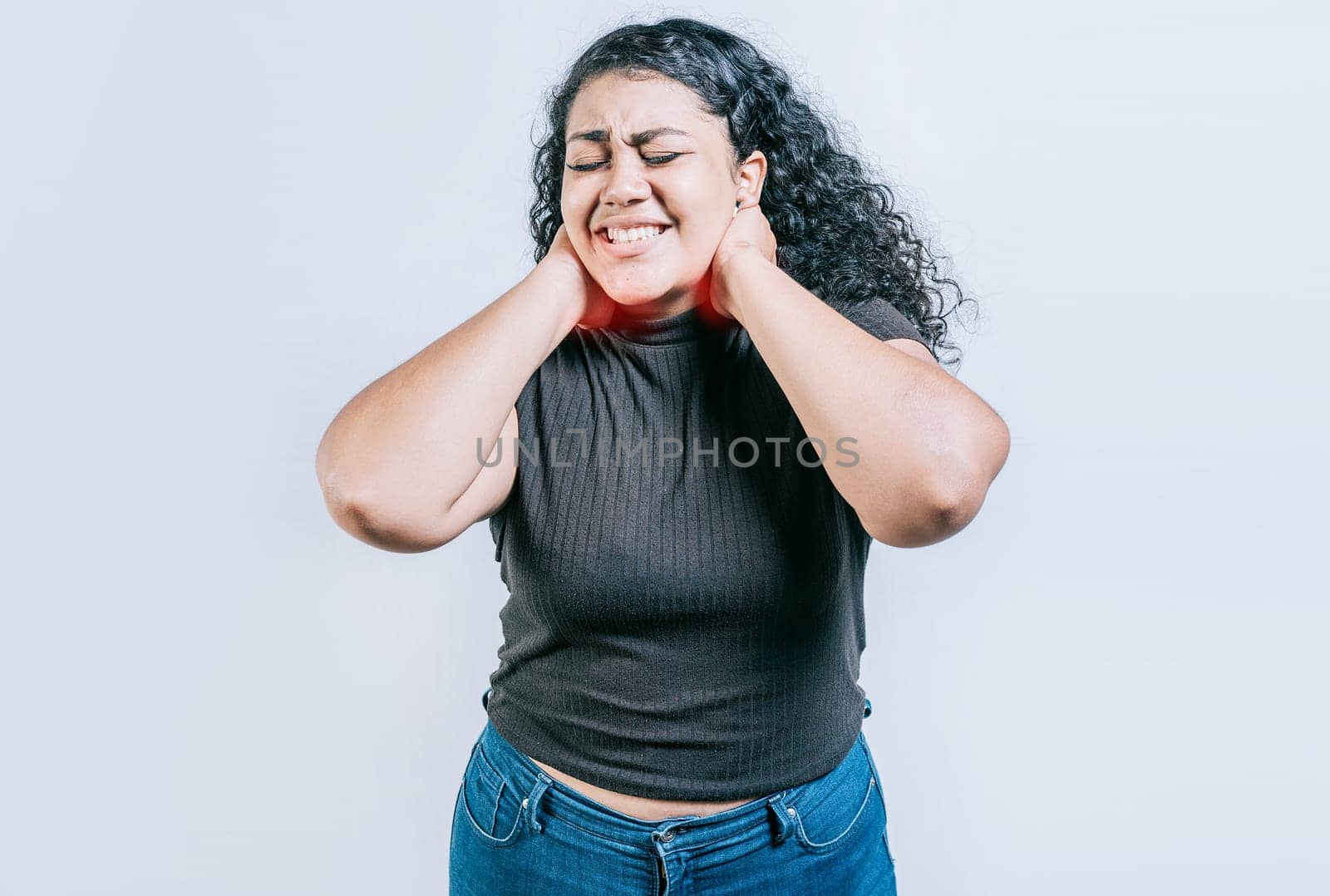 Girl with neck pain isolated. Young woman suffering with neck pain. Neck pain and stress concept. People with neck tension by isaiphoto