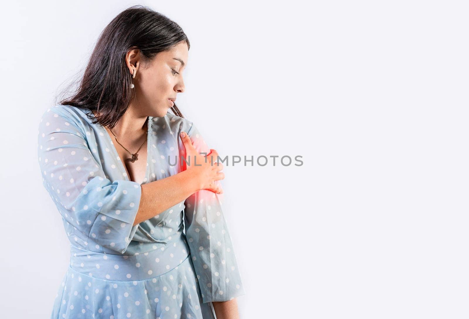 Woman with pain touching shoulder isolated. People with shoulder pain and tension on white background.