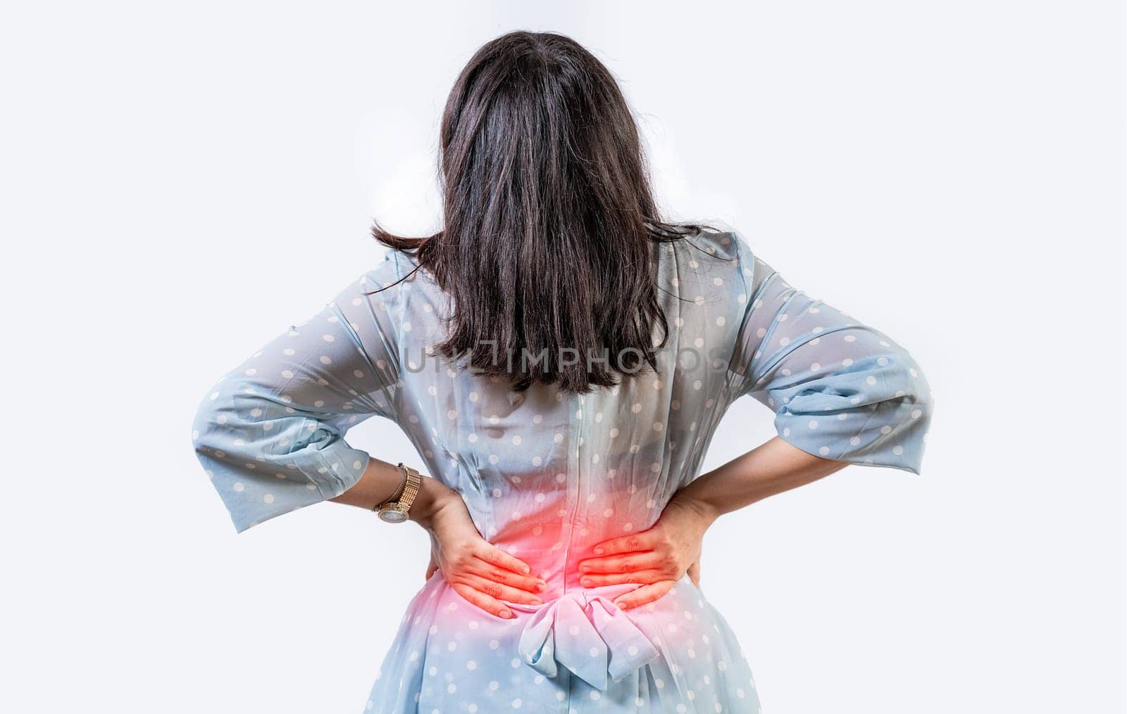 Girl with spine problems isolated. Woman with back pain on isolated background. lumbar problems concept. A sore girl with back pain by isaiphoto