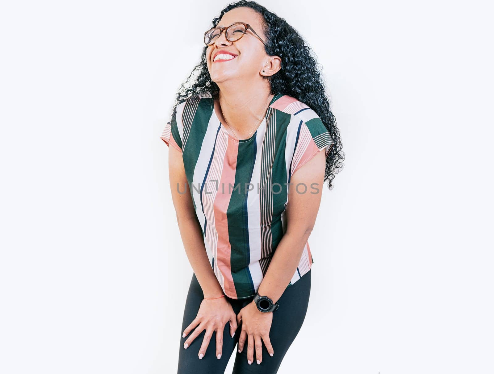 Young woman in glasses laughing out loud isolated. Funny young afro woman laughing on isolated background by isaiphoto