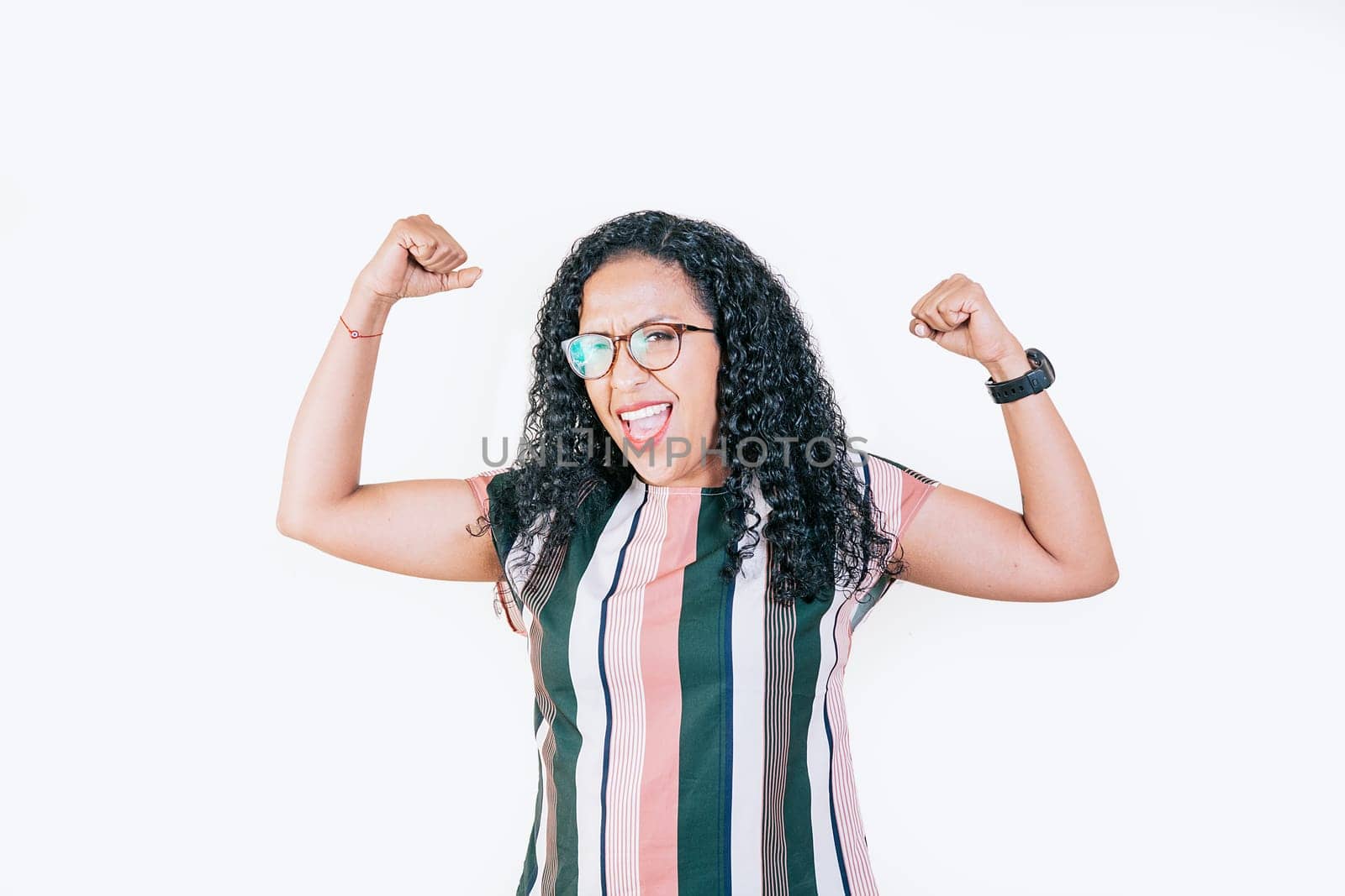 Happy woman raising arms in victory gesture isolated. Winning people celebrating triumph. Excited afro girl raising arms celebrating victory by isaiphoto
