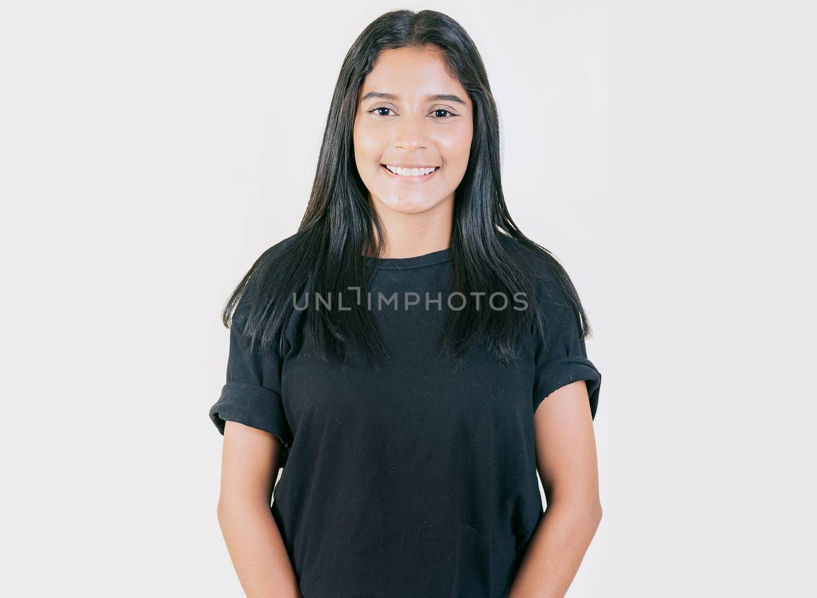 Portrait of happy Young girl with serene look isolated. Portrait of attractive latin girl smiling isolated. Nicaraguan woman concept in isolated background by isaiphoto
