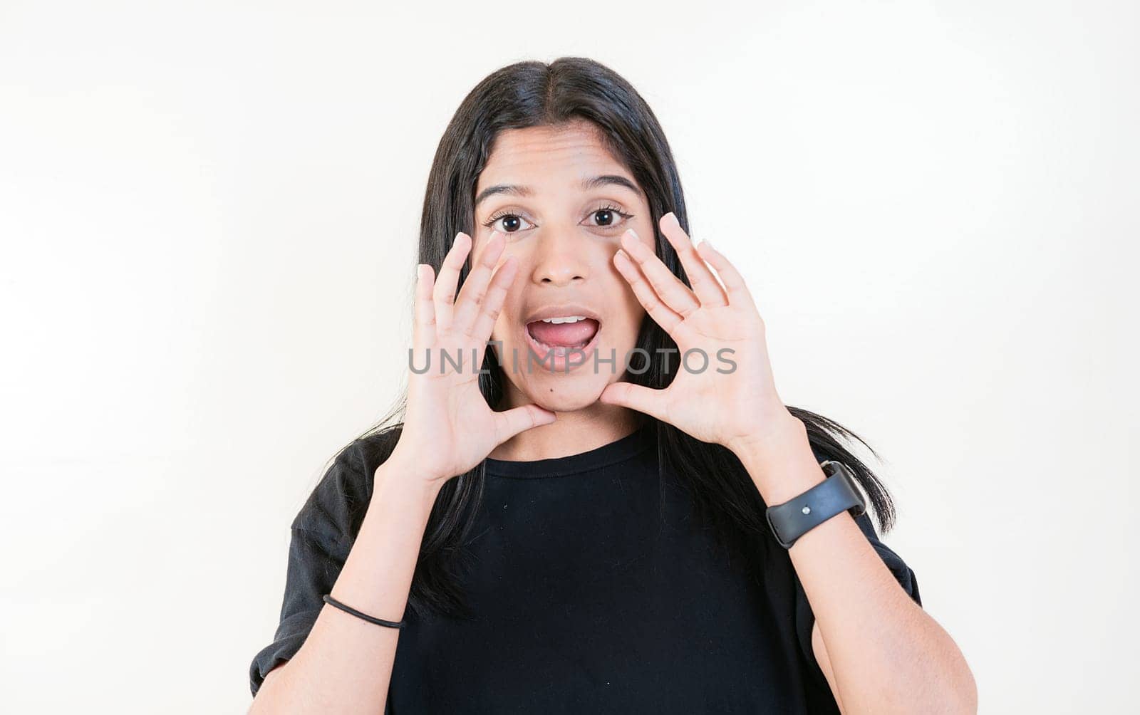 Young girl announcing something to the camera. Young woman screaming and announcing at the camera by isaiphoto