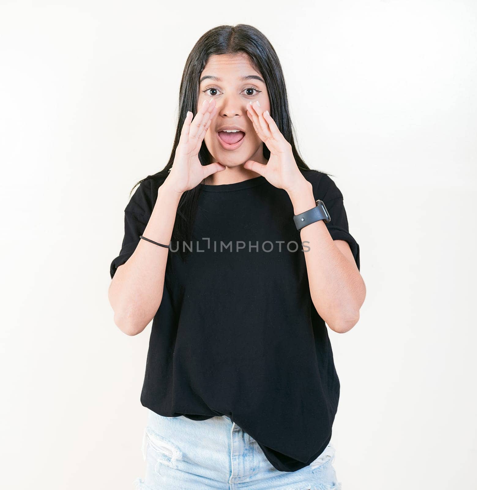 Young woman screaming and announcing at the camera. Young girl announcing something to the camera by isaiphoto