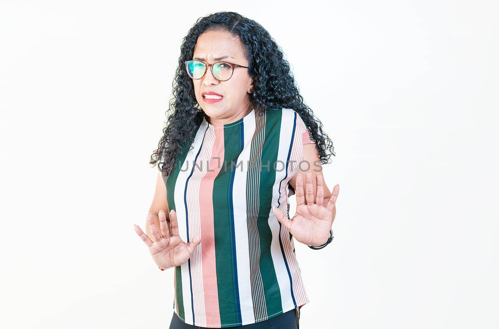 Afro woman with face disgusted on isolated background.. Woman in glasses with disgust face isolated by isaiphoto