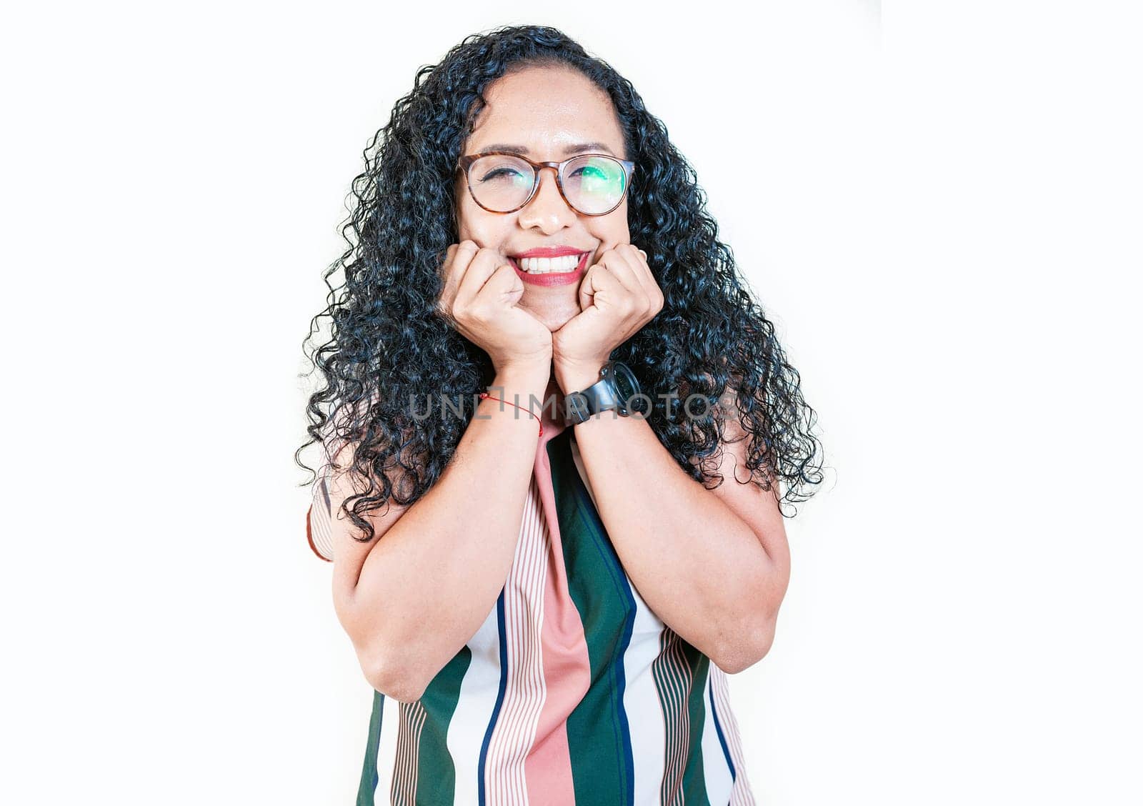 Cheerful and friendly afro young woman looking and smiling at the camera. Portrait of friendly afro girl in glasses smiling isolated. Young Nicaraguan woman smiling at camera by isaiphoto