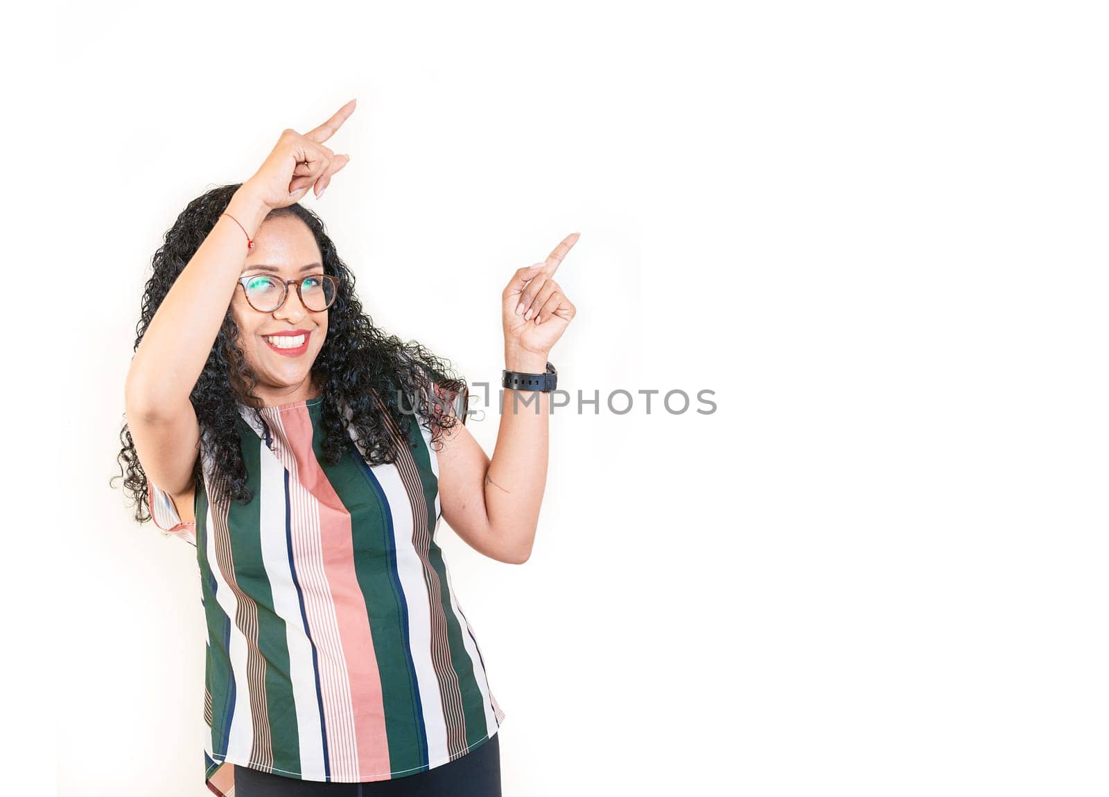 Happy afro young woman pointing an advertising side. Beautiful afro girl pointing to a banner to the side. Happy people pointing a promo isolated by isaiphoto