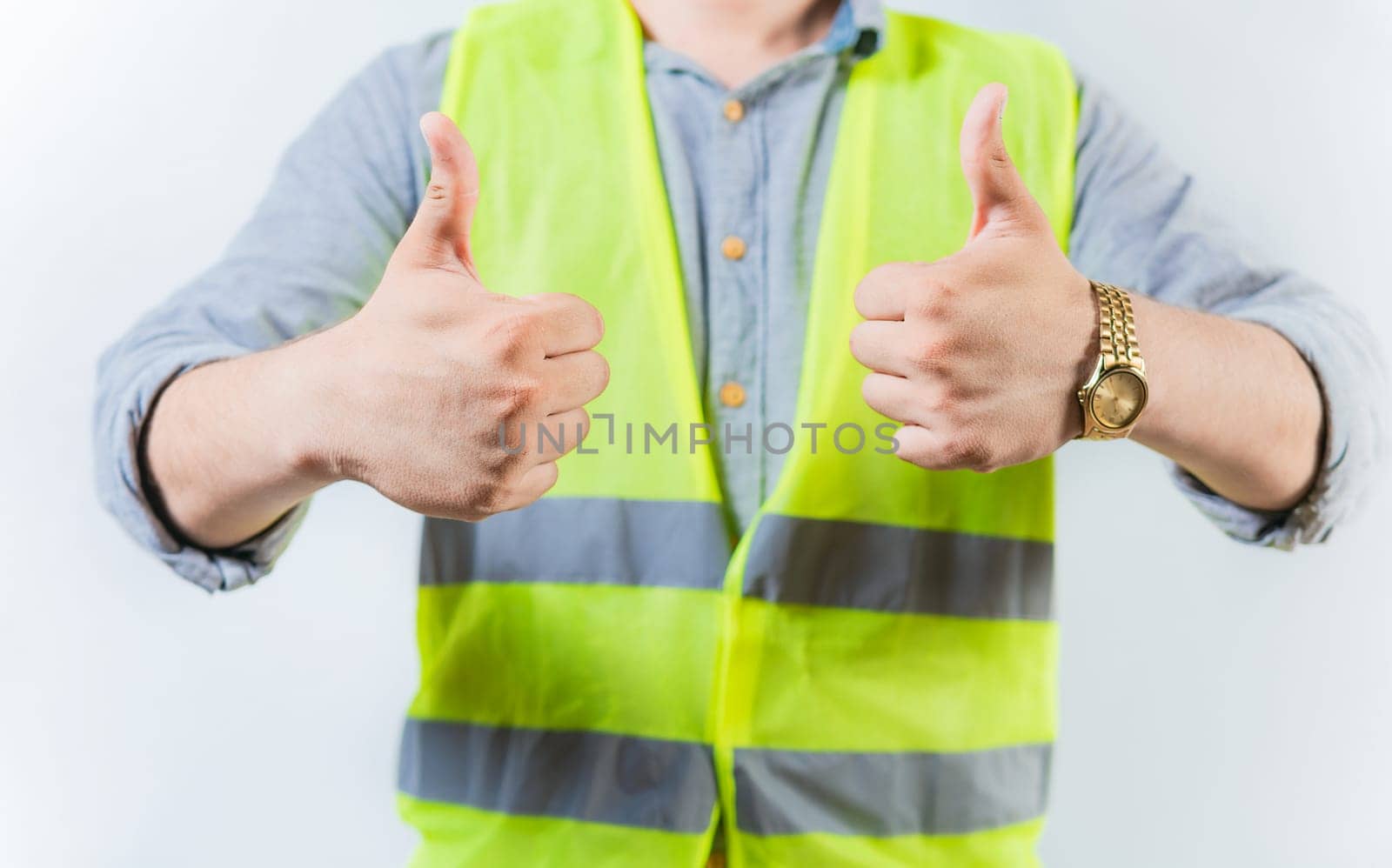 Engineer hands with thumbs up in approval gesture isolated. Engineer thumbs up in approval gesture on isolated background by isaiphoto
