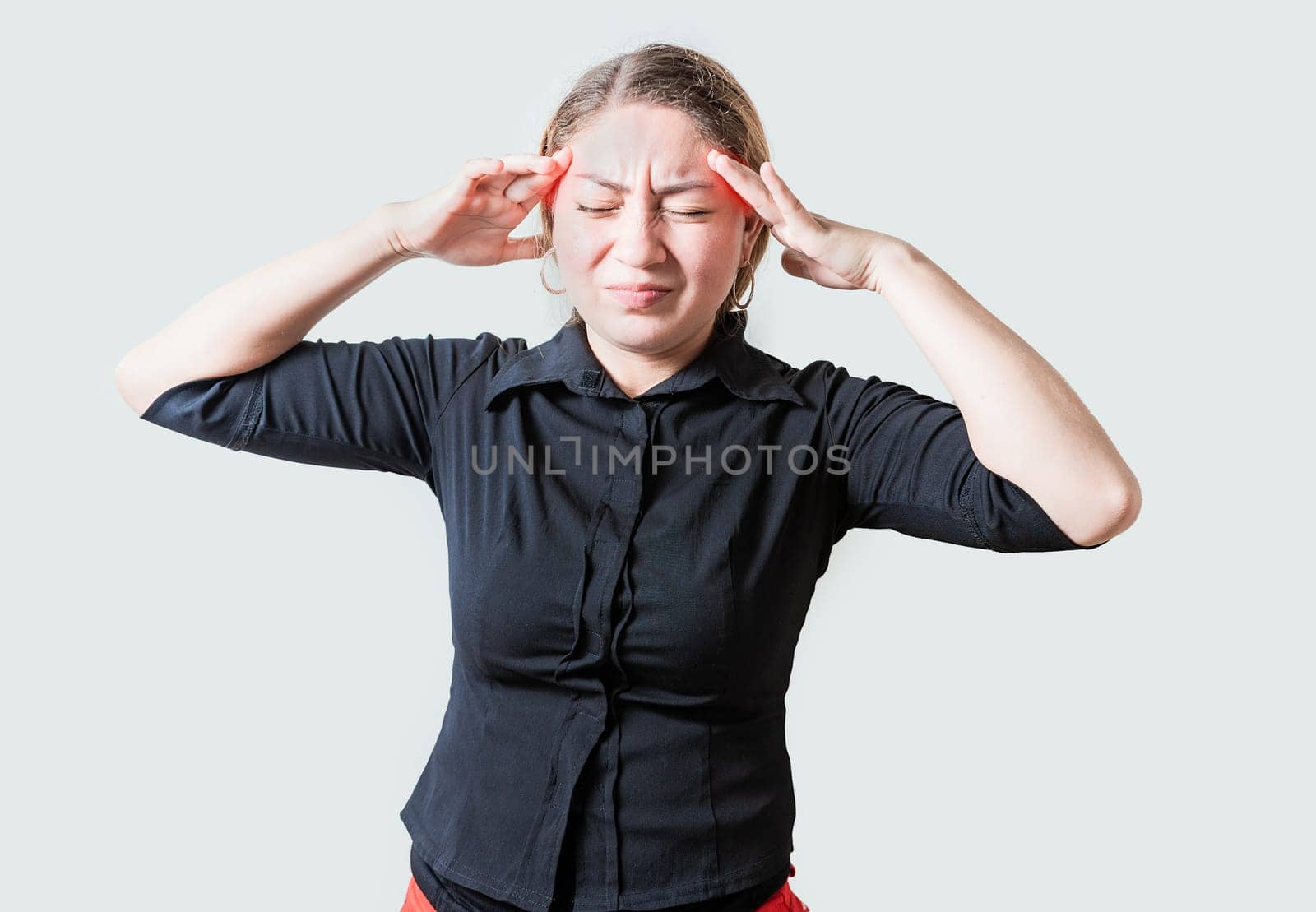 Young woman with headache isolated. Portrait of girl suffering from migraine on isolated background. Headache concept by isaiphoto