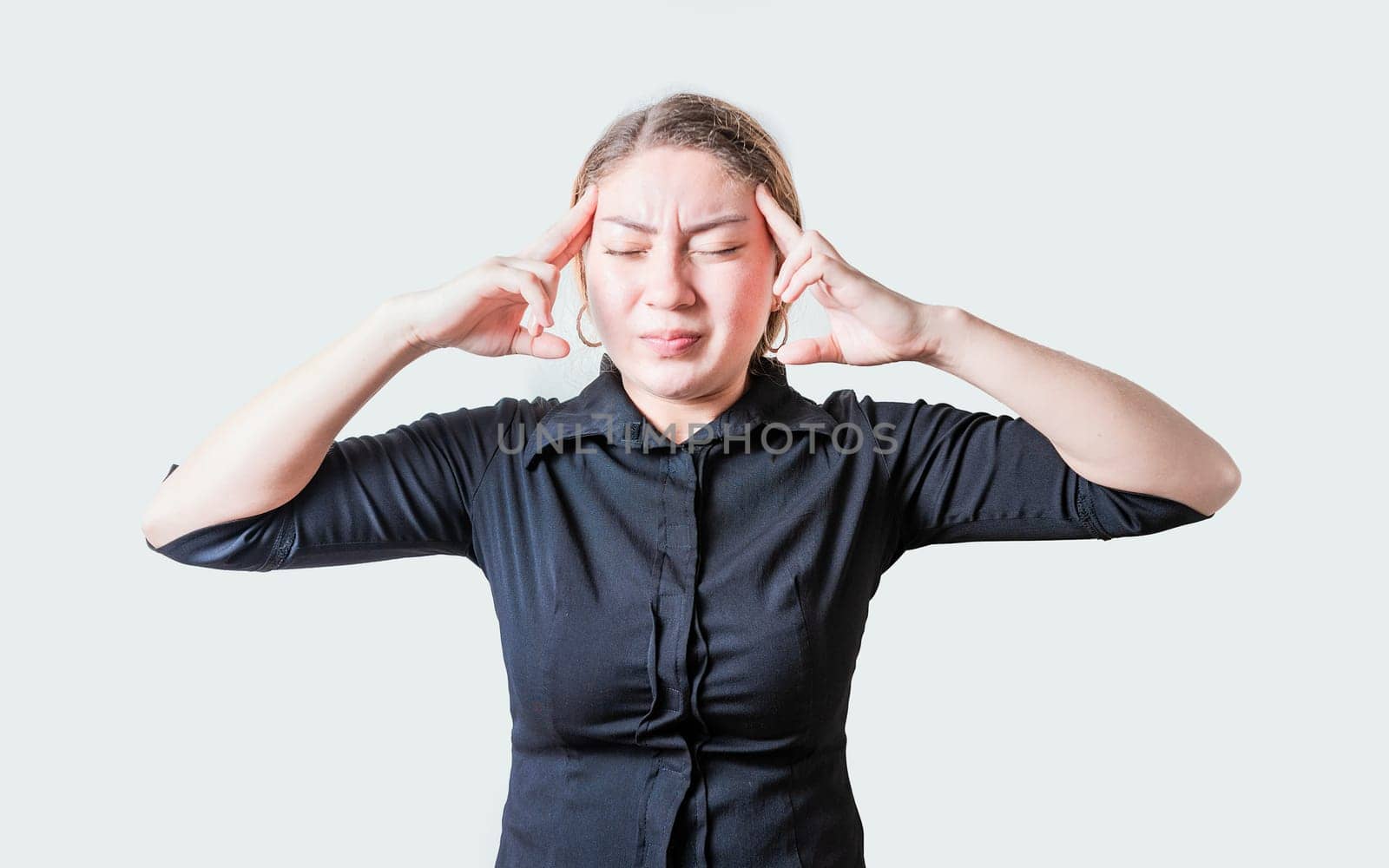 People suffering from migraine on isolated background. Headache concept. Young woman with headache isolated by isaiphoto
