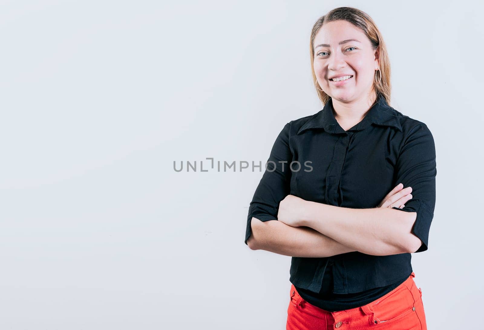 Beautiful young latin woman with arms crossed isolated. Attractive latin woman with arms crossed isolated. Latin people with arms crossed isolated by isaiphoto