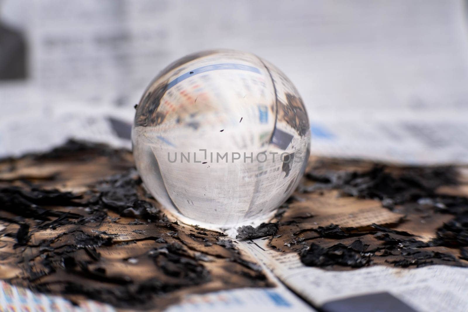 Glass globe on fire. Planet Earth Burning. Global Warming and Climate Change Concept. by TEERASAK