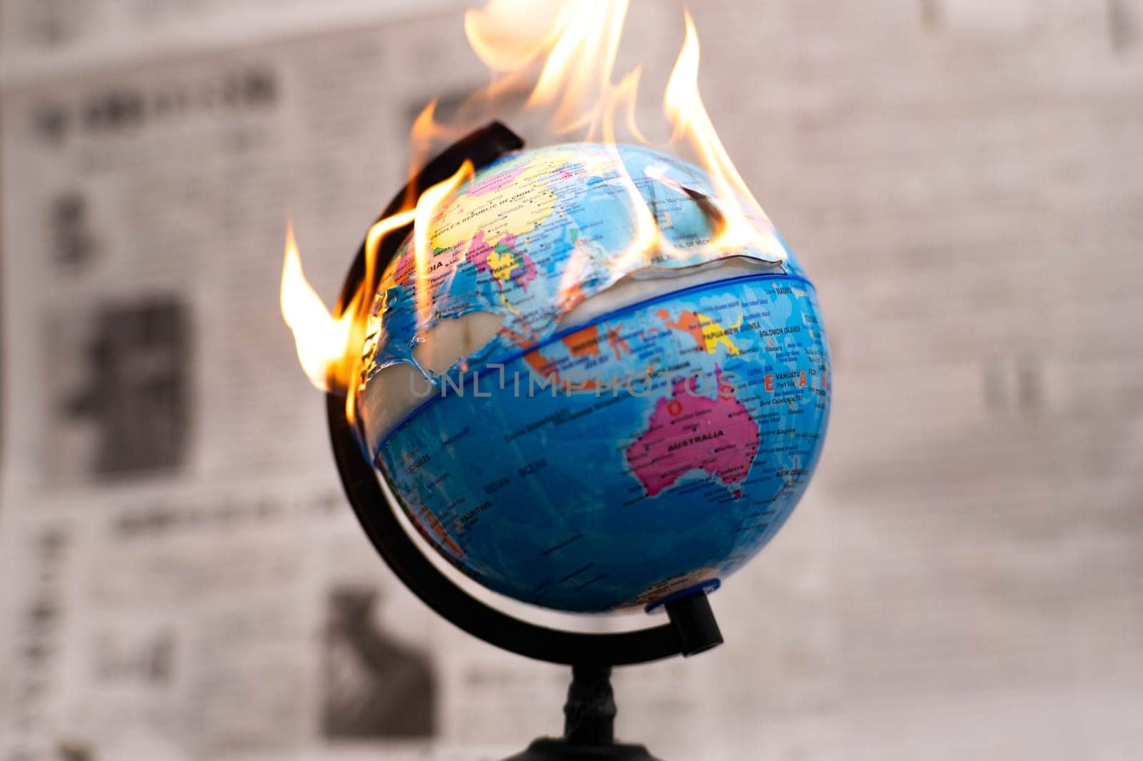 Model globe on fire. Planet Earth Burning. Global Warming and Climate Change Concept.