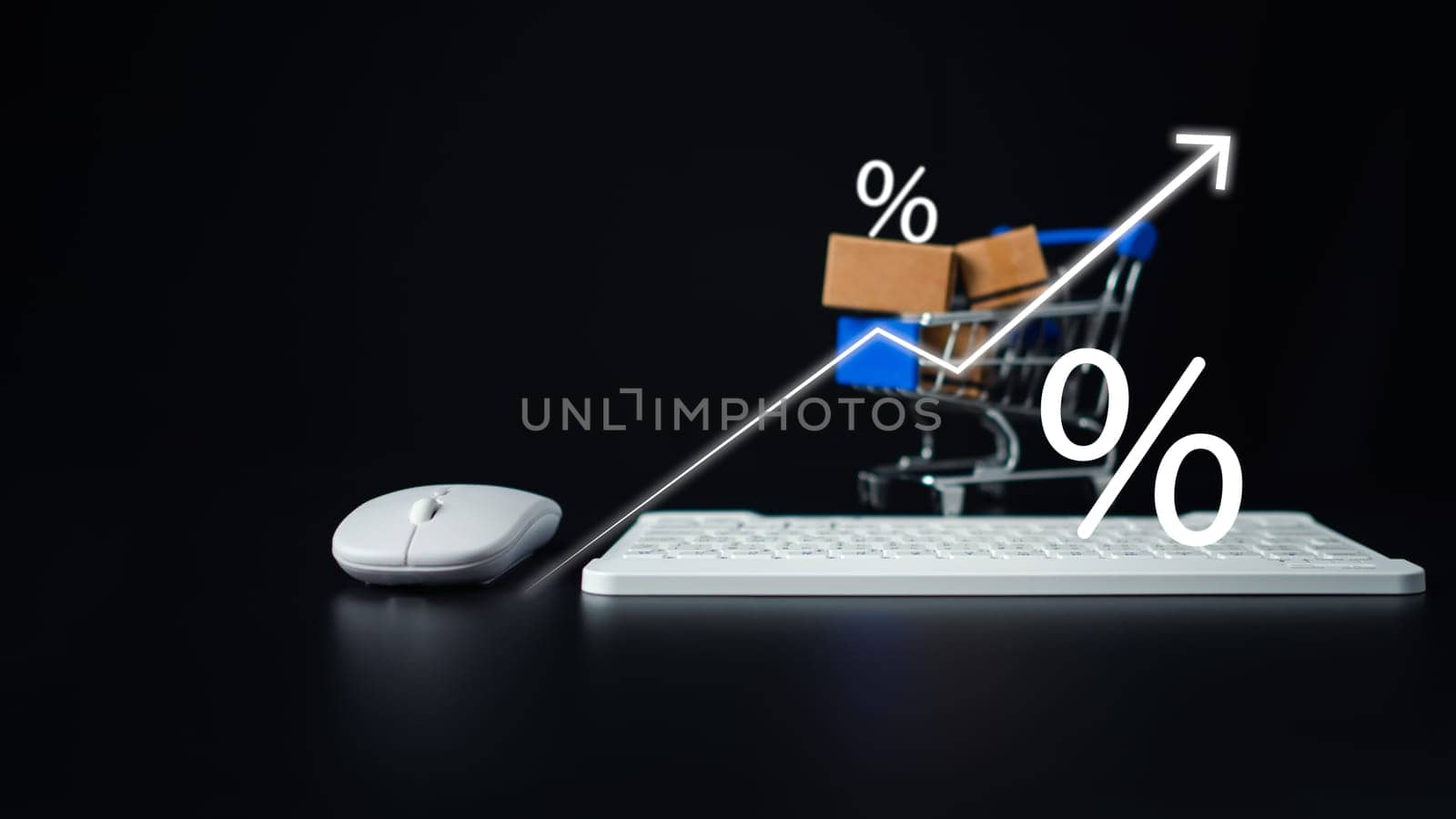 Boxes in a shopping car and keyboard on dark background. Ideas about online shopping, Online shopping for electronic commerce, Allows consumers to directly buy goods from seller over the internet. by Unimages2527