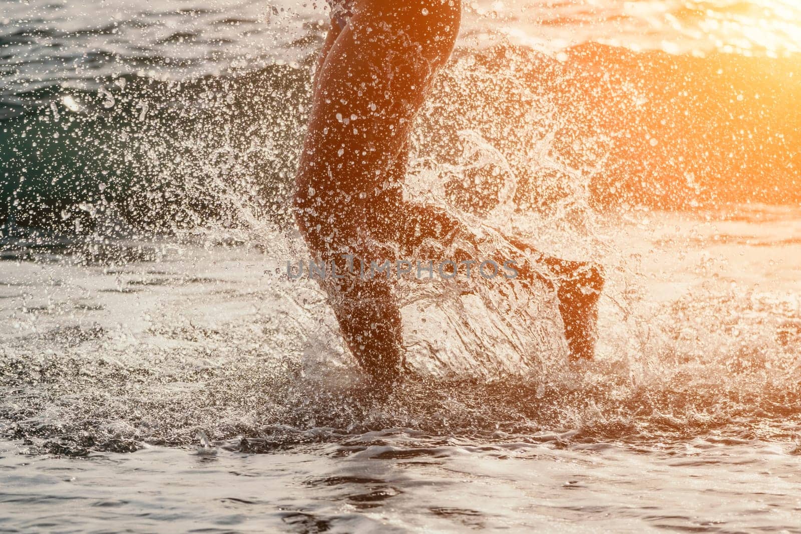 Running woman on a summer beach. A woman jogging on the beach at sunrise, with the soft light of the morning sun illuminating the sand and sea, evoking a sense of renewal, energy and health. by panophotograph