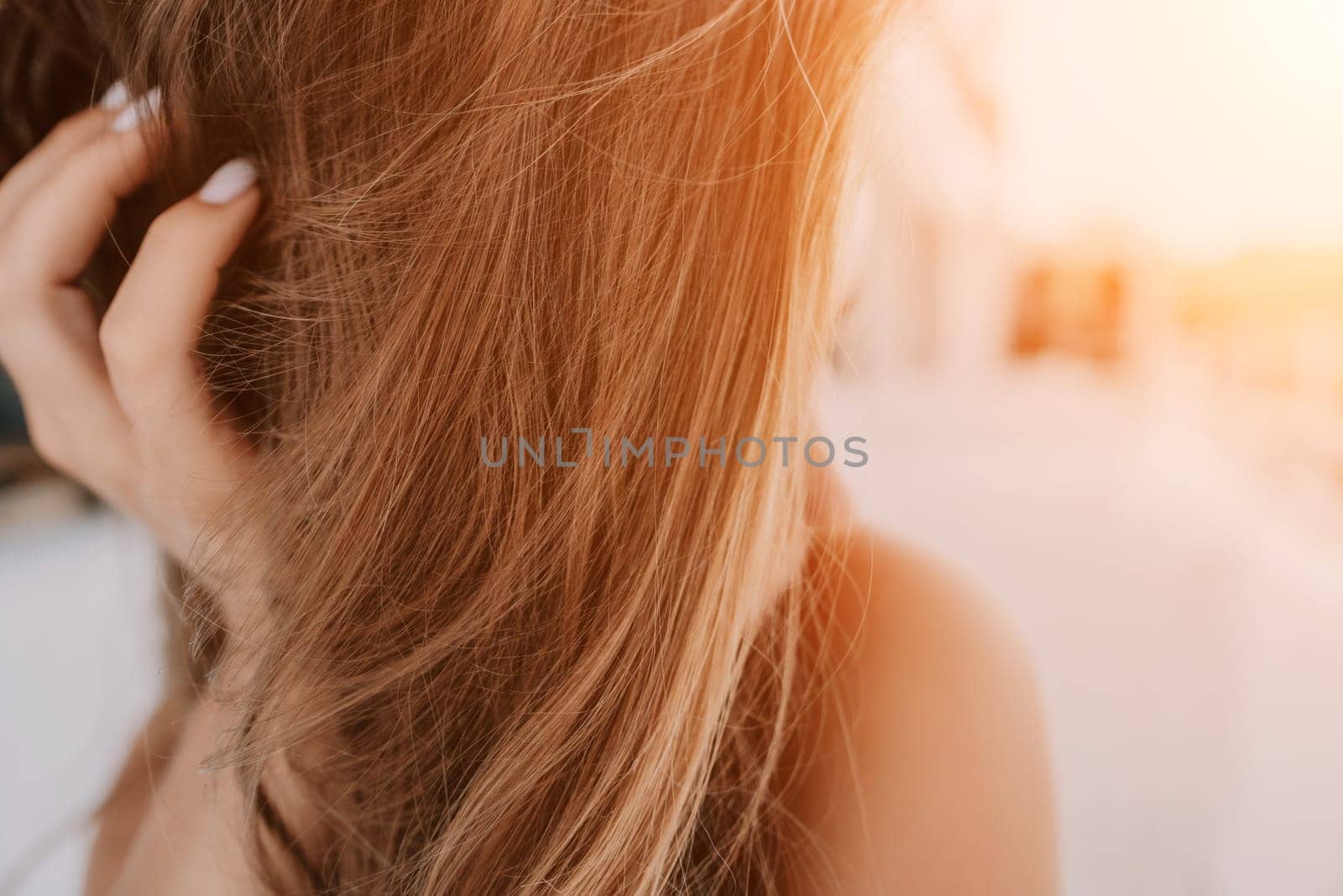 Happy woman portrait in cafe. Boho chic fashion style. Outdoor photo of young happy woman with long hair, sunny weather outdoors sitting in modern cafe