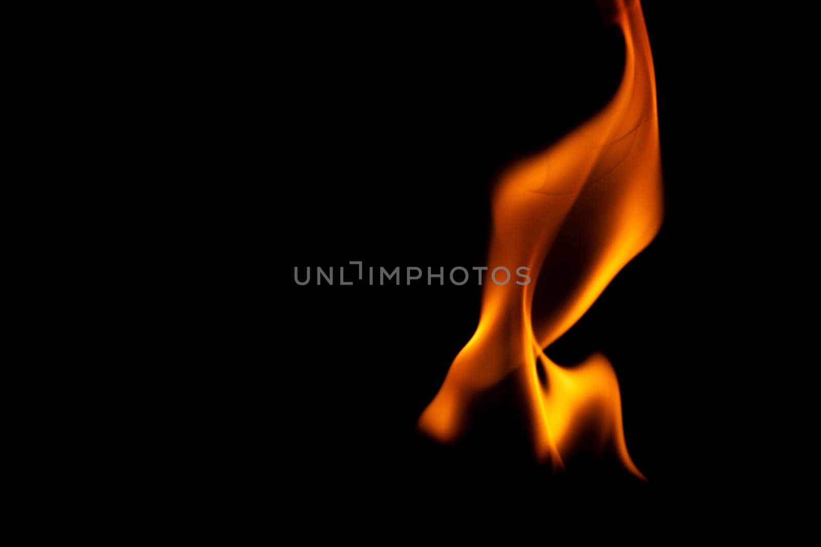 Hot flames on a black background. Beautiful flame of fire in the dark. Abstract of burning flames and smoke. by TEERASAK