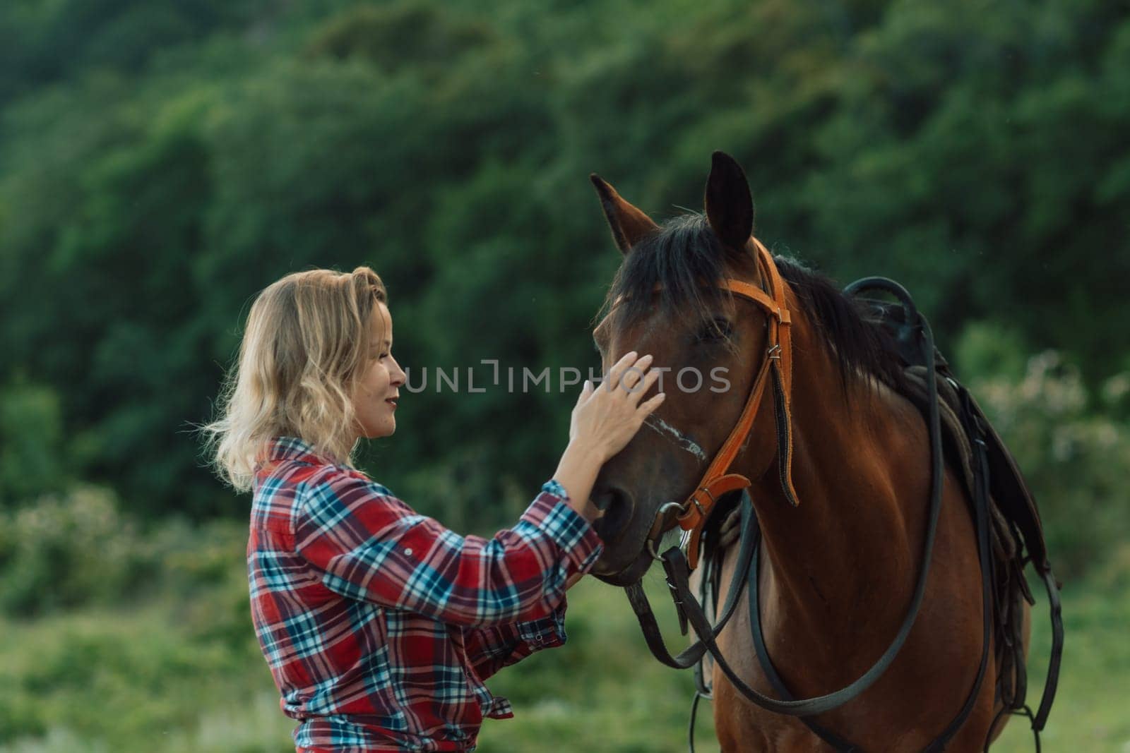 Happy blonde with horse in forest. Woman and a horse walking through the field during the day. Dressed in a plaid shirt and black leggings. by Matiunina