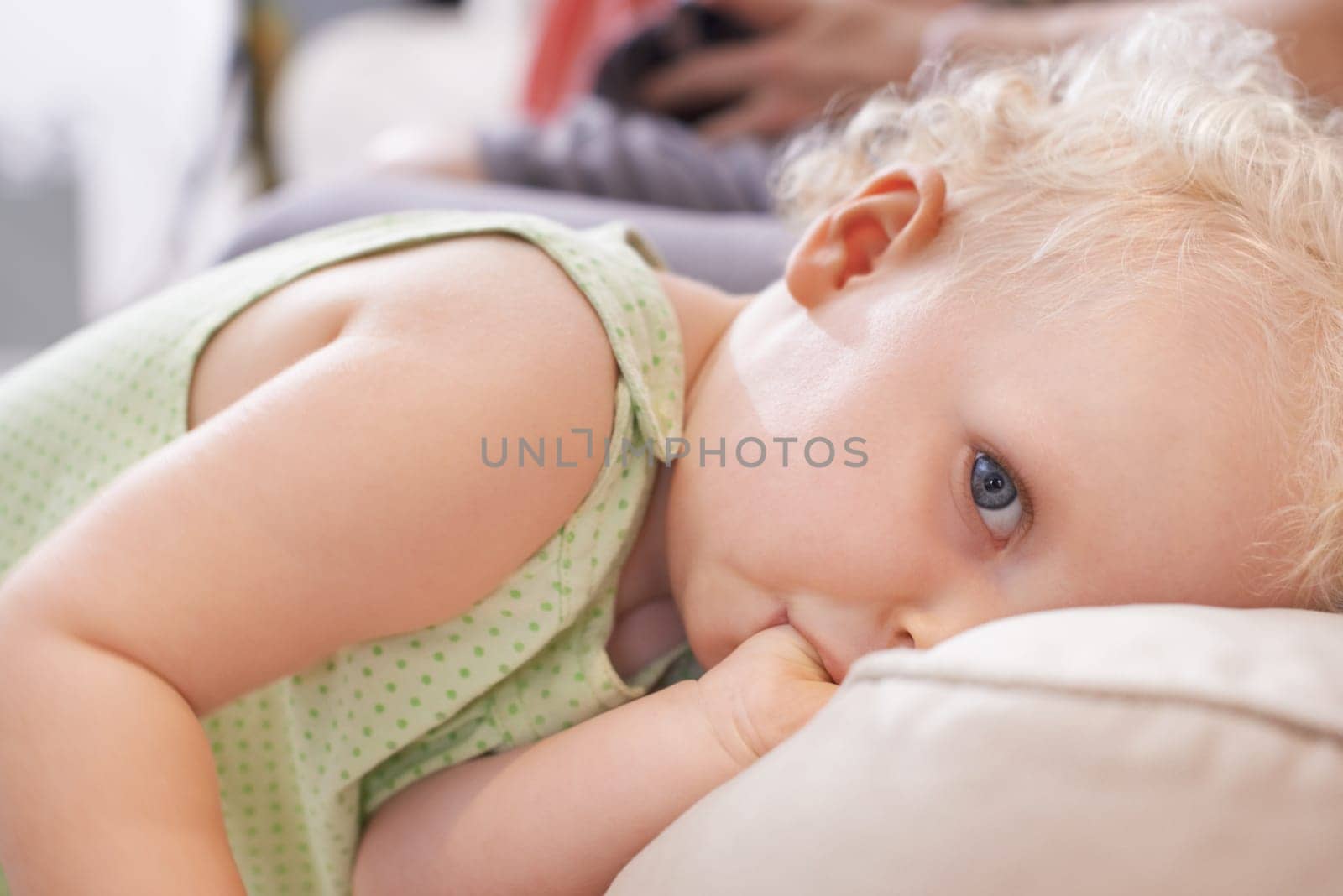 Portrait, baby and kid suck thumb in home, adorable or cute innocent child alone in house. Face of young blonde toddler, finger in mouth or facial expression of healthy girl in comfort in Switzerland.