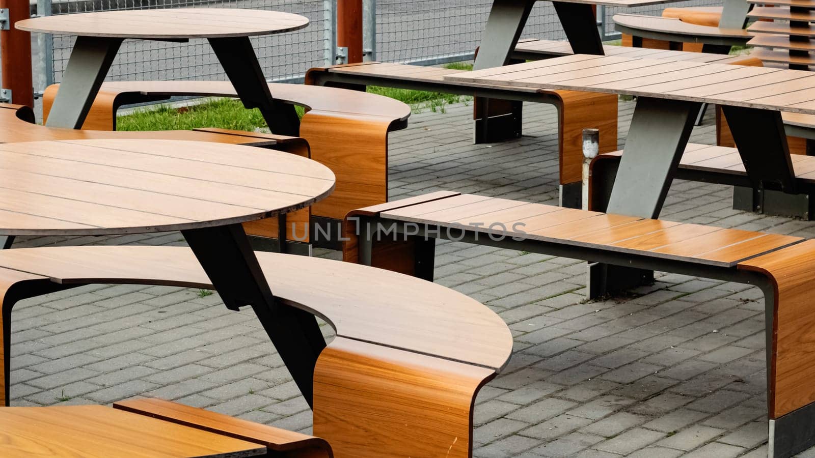 Wooden tables and chairs in a cafe outdoor by Vera1703