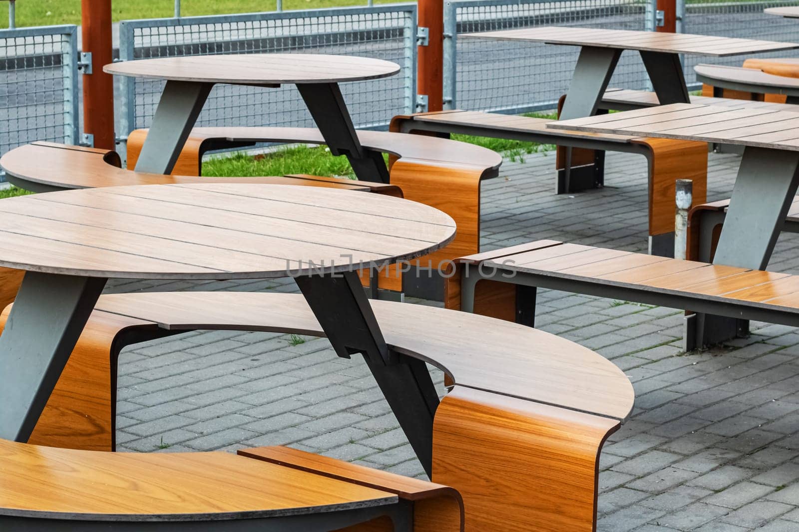 Wooden tables and chairs in a cafe outdoor by Vera1703