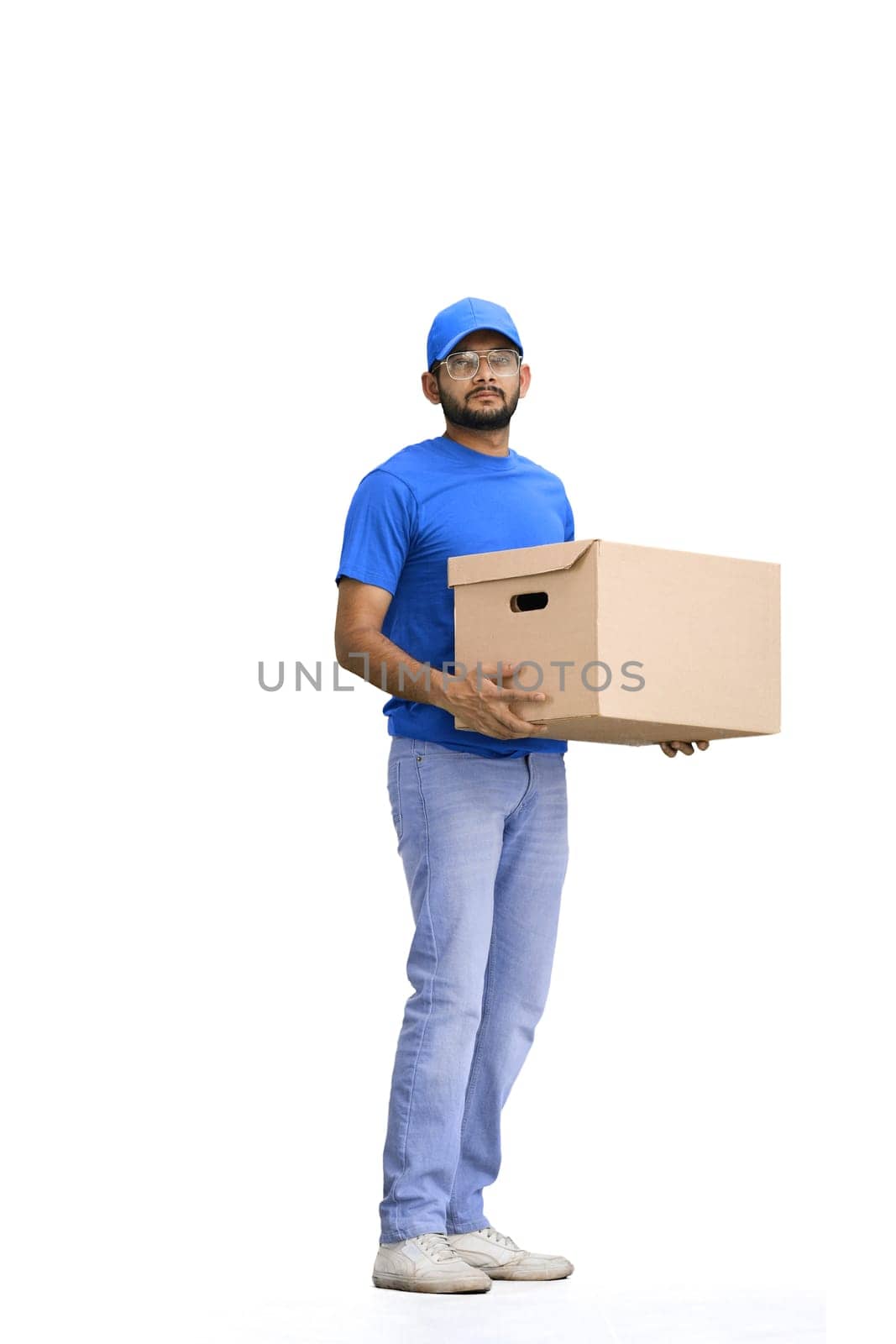 A male deliveryman, on a white background, full-length, with a box.