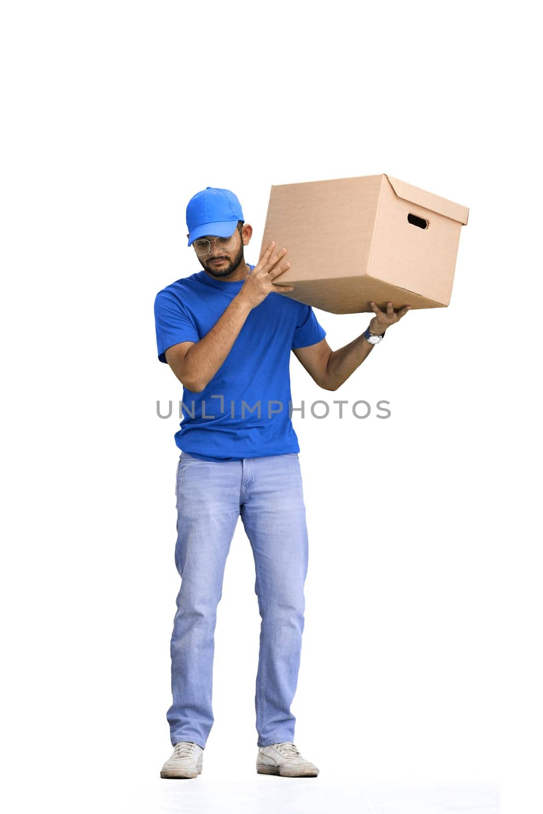 A male deliveryman, on a white background, in full height, shakes a box by Prosto