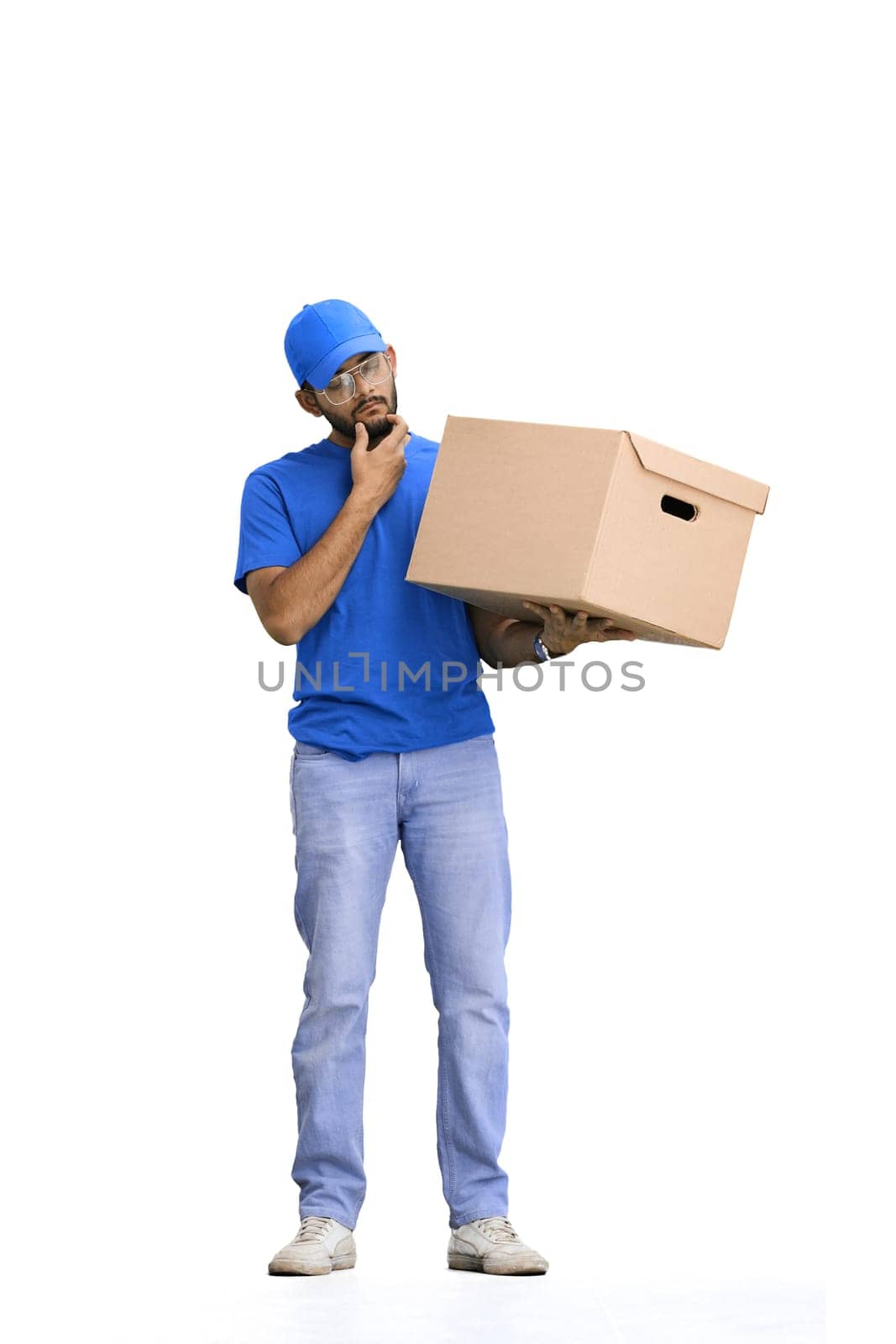 A male deliveryman, on a white background, in full height, thinks.