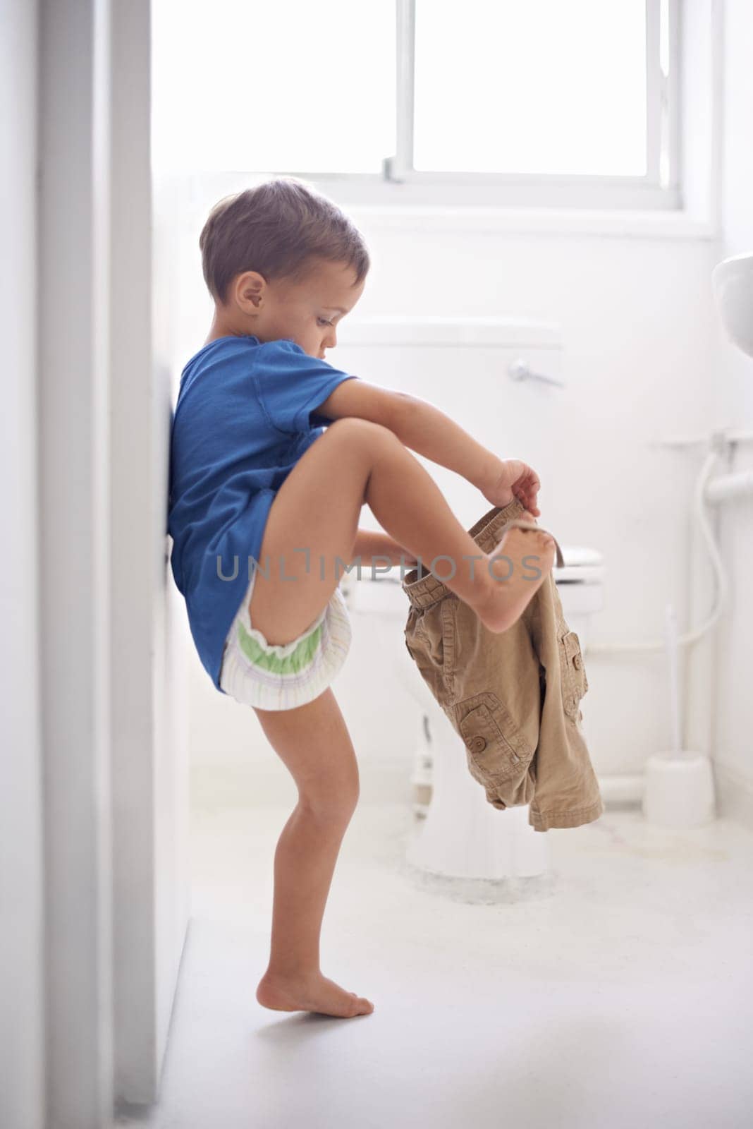 Child, bathroom and toilet training for learning growth, milestone or hygiene. Male person, kid diaper and pants or step for development in home for parent care for toddler teaching, health or love.