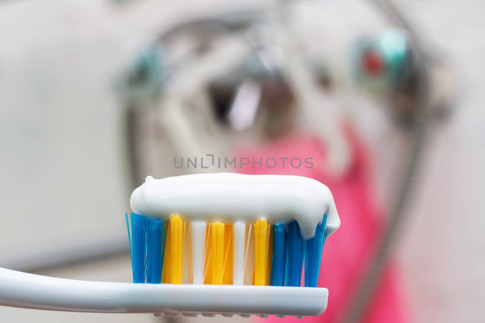 Tooth brush and white toothpaste close up with copy space