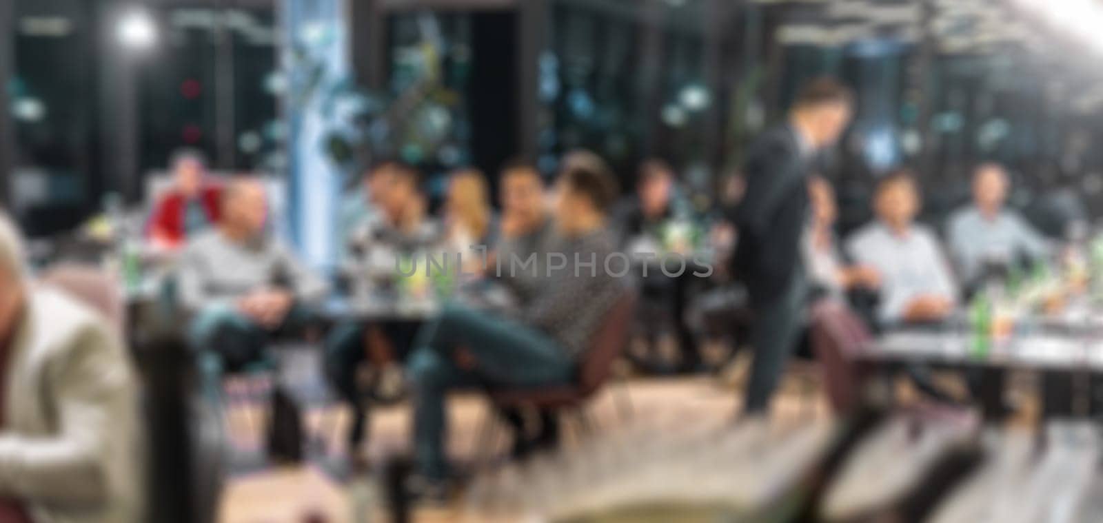 Blurred image of businesspeople at banquet business meeting event. Business and entrepreneurship events concept by kasto