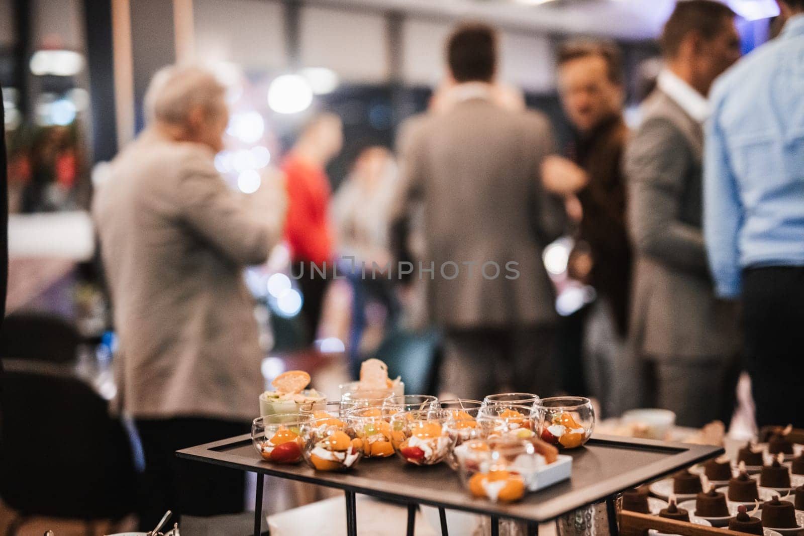 Blurred image of businesspeople at banquet business meeting event. Business and entrepreneurship events concept. Focused on the canapes. by kasto