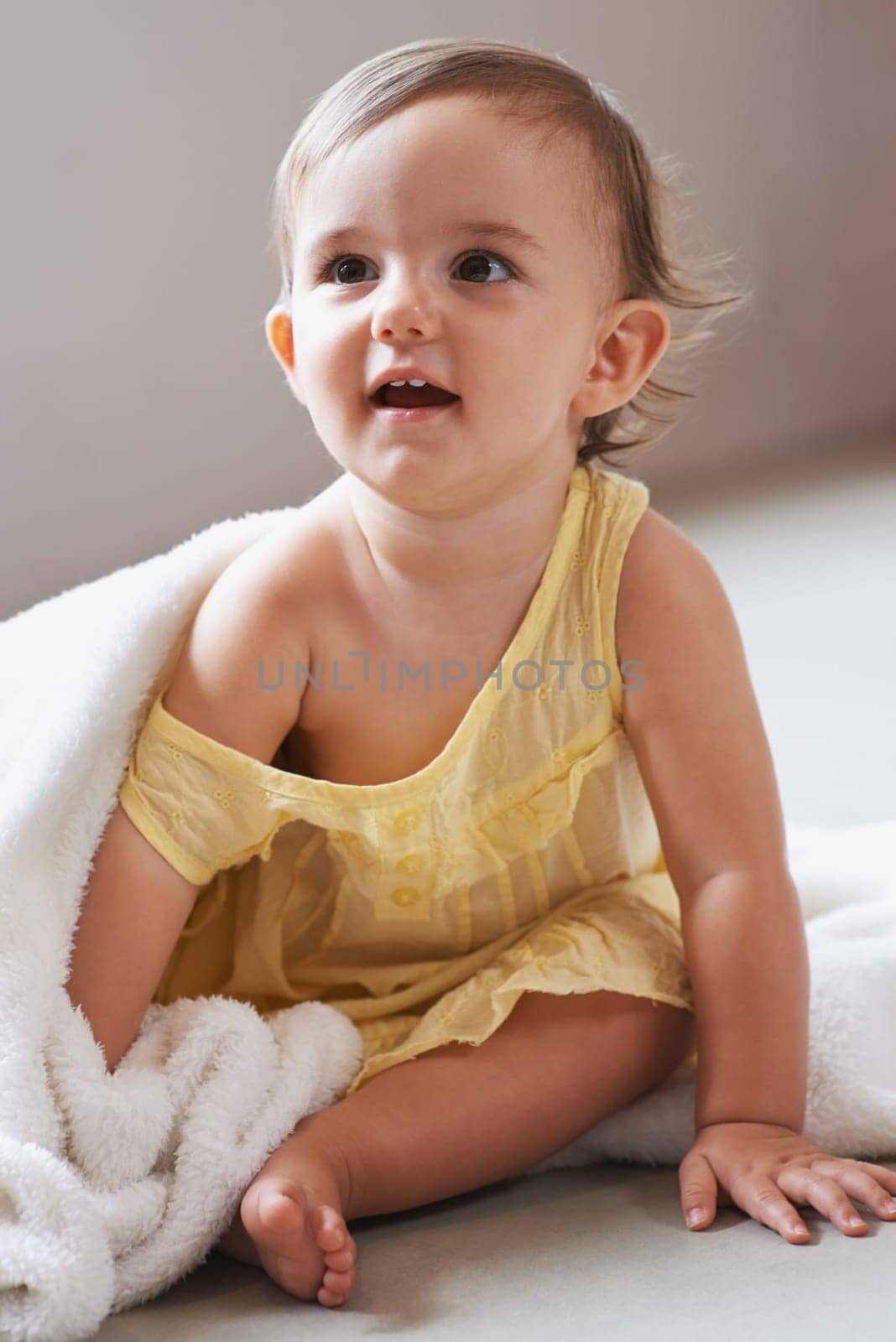 Baby, girl and blanket or toddler at home, child development and curious for childhood. Female person, healthy kid and sweet or comfort at house, peaceful and playing on floor or relaxing for growth.