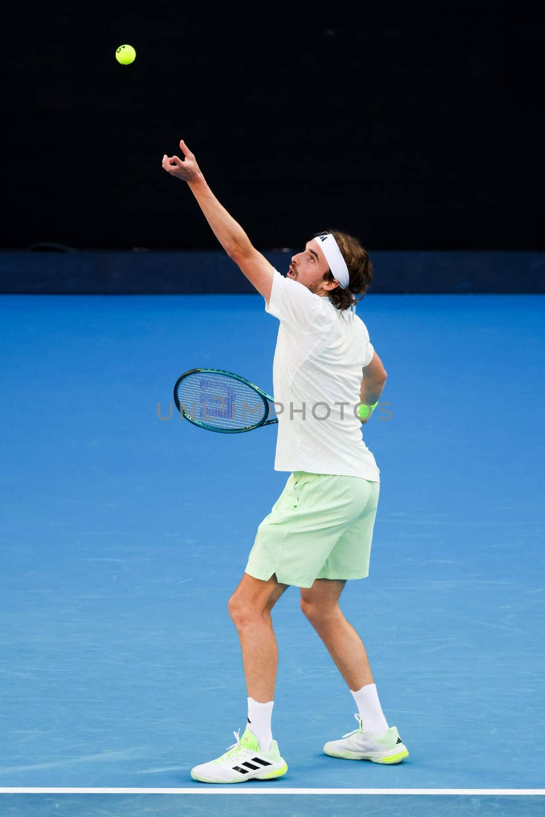 MELBOURNE, AUSTRALIA - JANUARY 11: Stefanos Tsitsipas of Greece plays against Novak Djokovic of Serbia during a charity match ahead of the 2024 Australian Open at Melbourne Park on January 11, 2024 in Melbourne, Australia.