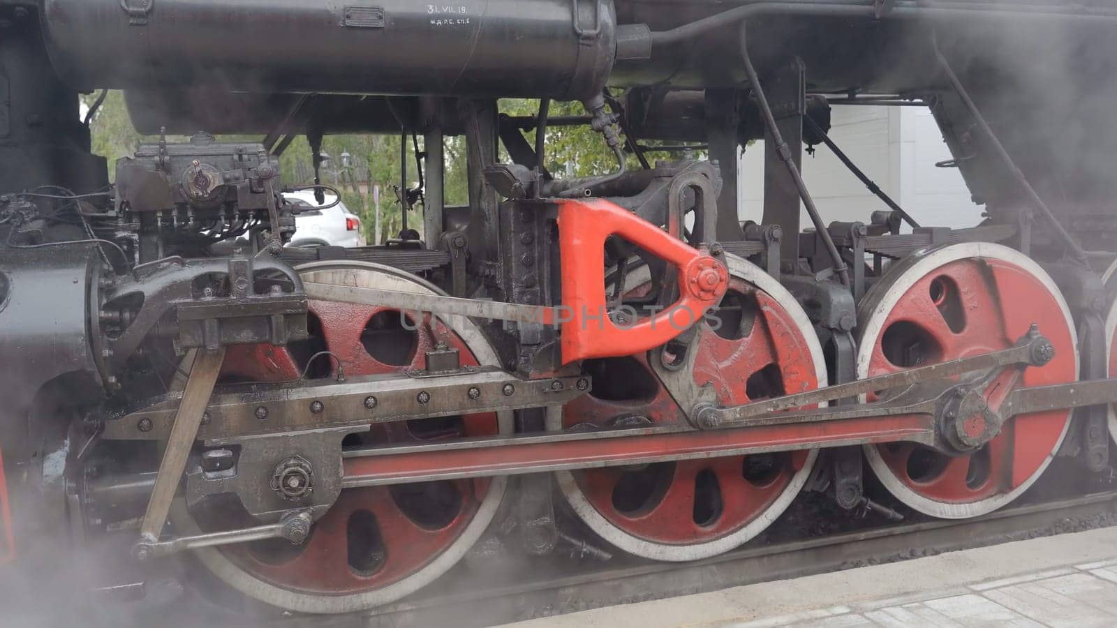 Sortavala, Russia - July 22, 2020: Wheels of an old Soviet steam locomotive. by DovidPro