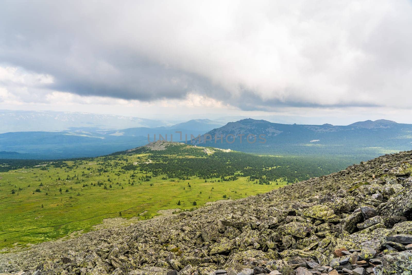 Forests and mountains of the Southern Urals near the village of Tyulyuk in Russia. Drone view